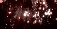 snowflakes and stars are shown in the dark sky with light coming from them