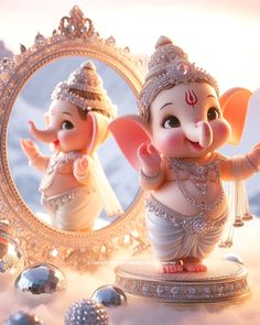 there is an elephant statue in front of a mirror with the image of ganesh on it