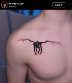 a man with a tattoo on his chest that has a large black spider hanging from it's back