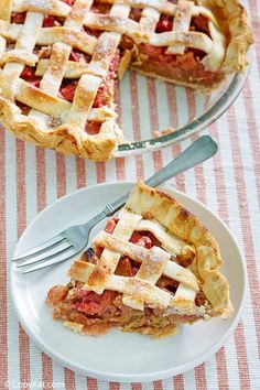 a slice of pie on a plate with a fork and knife next to the pie