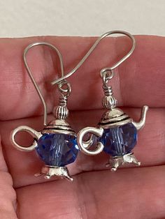 "18mm wide silver plated pewter tea pot dangle earrings, ornate with a10mm faceted crystal glass beads. Available in 10 colors to choose from. Dangle about 1.25\" long. Stainless steel fish hook wire. Hand made jewelry! All purchase will arrive in gift boxes! Thanks for stopping by!" Nickel-free Czech Glass Crystal Earrings As Gift, Nickel-free Czech Glass Crystal Earrings For Gift, Nickel-free Czech Glass Jewelry Gift, Antique Silver Jewelry With Matching Earrings For Gift, Silver Czech Glass Jewelry With Matching Earrings, Sterling Silver Crystal Earrings With Round Beads As Gift, Sterling Silver Beaded Crystal Earrings For Gift, Sterling Silver Crystal Beaded Earrings For Gift, Silver Czech Glass Earrings As Gift