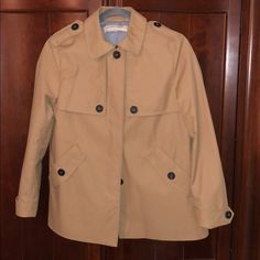 Never Worn Zara Jacket Made Of 100% Polyester And Fully Lined. It Is Water Repellent And Light Weight. Has Two Deep Pockets In The Front And Is Complemented With Large Brown Buttons. Zara Classic Khaki Outerwear, Classic Zara Khaki Outerwear, Classic Khaki Zara Outerwear, Zara Collared Outerwear With Snap Buttons, Zara Jacket, Zara Jackets, Repellent, Water Repellent, Jackets & Coats