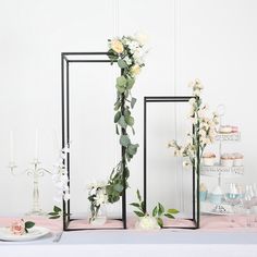 the table is decorated with flowers and candles