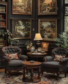 a living room filled with furniture and paintings on the wall