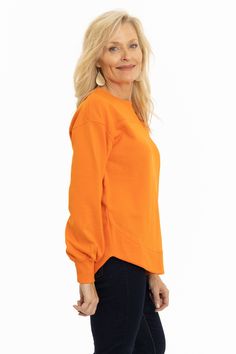 A orange relaxed fit crewneck sweatshirt with front and back yoke detailing. A soft French terry fabric features balloon sleeves with ribbed cuff and rounded hemline. 80% cotton/ 20% poly. Boutique Sales, Terry Fabric, French Terry Fabric, Balloon Sleeves, French Terry, Crewneck Sweatshirt, Bell Sleeve Top, Crew Neck Sweatshirt, Relaxed Fit