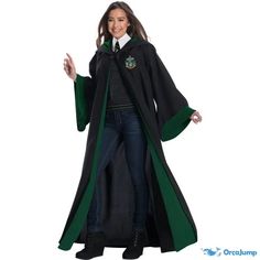 a woman in a harry potter costume is standing with her hands out and smiling at the camera