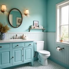 a bathroom with blue walls and white fixtures