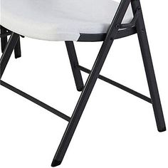 a white plastic folding chair with black frame