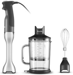 an electric blender with two attachments next to it