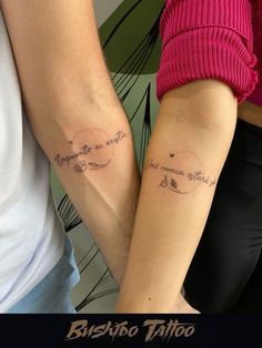 two people holding hands with tattoos on their arms and the words love are written in cursive writing