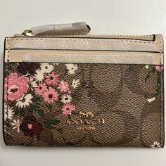 Brand New With Tags Never Used Gorgeous Coach Mini Skinny Id Case Signature Canvas With Evergreen Print Signature Coated Canvas And Smooth Leather Credit Card Slot And Id Window Zip Top Closure, Fabric Lining Attached Spilt Key Ring 4 1/4” (L) X 3” (H) Smoke Free And Pet Free Home The Wallet In A Plastic Wrap, Brand New Beige Wallets For Spring, Brown Coach Coin Purse With Interior Card Slots, Brown Rectangular Coach Coin Purse, Coach Brown Wallet With Coin Pocket, Coach Floral Wallet, Mirror Keychain, Coach Keychain, Coach Brown Wallets For On-the-go, Pink Flip Flops