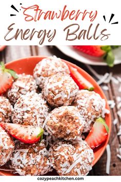 strawberry energy balls in a bowl with coconut sprinkles and strawberries on the side