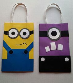 two paper bags decorated to look like minion characters