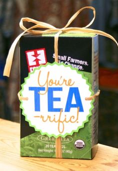 a box of tea sitting on top of a wooden table