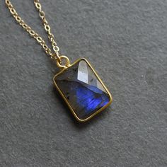 Meet your new favorite accessory, the Rectangular Labradorite Gold Vermeil Necklace. This elegant pendant necklace adds a touch of sophistication to your neckline, pair this with a cream blouse and tan pants for a refined look. Also, labradorite is known for its ability to recharge and rejuvenate. Size - 19x11mm pendant, 4mm rondelle beads, chain is 16 inches and includes an additional 2" extender Metals - gold filled chain and components, gold vermeil faceted pendant Materials - labradorite pen Elegant Gold Necklace With Labradorite, Elegant Gold Labradorite Necklace, Elegant Labradorite Necklace Gift, Elegant Labradorite Necklace For Gift, Morse Code Necklace, Cream Blouse, Tan Pants, Beads Chain, Triangle Pendant