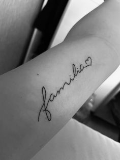 a person with a name tattoo on their arm