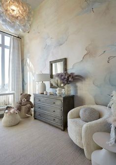 a bedroom with two teddy bears on the bed and a dresser in front of it