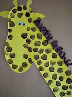 a paper giraffe with lots of holes in it