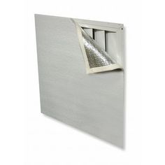 an open window on the side of a wall with silver foil covering it's windows