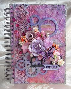 an altered book with flowers on it