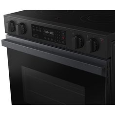 a black oven with the door open on an isolated white background