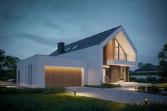 a modern house is lit up at night