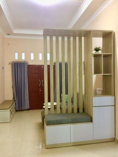 a living room filled with furniture next to a book shelf and shelves on the wall