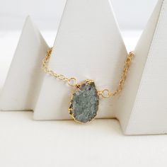 The sweetest and most unique piece for your jewelry collection. This necklace can be layered, or worn alone. GEMSTONE: Aquamarine SIZE: Varies in size from 12mm-24mm CHAIN: 17" long 14k gold filled / sterling silver CLOSURE: Lobster clasp *PLEASE NOTE - Due to the one-of-a-kind nature of the stones, exact colors and patterns may vary slightly from the image shown. Dainty Gemstone Necklace, Gems Jewelry, Simple Necklace, Gold And Silver, Gemstone Necklace, Layered Necklaces, Crystal Necklace, Aquamarine, Lobster Clasp