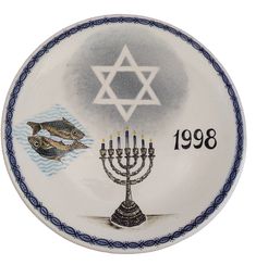 a plate with an image of menorah and fish on it