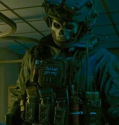 a skeleton wearing a helmet and vest in a dark room with lights on the ceiling