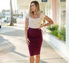 women posing looking to the left Stretch Lined Pencil Skirt For Day Out, Stretch Pencil Skirt With Lined Detail For Day Out, Chic Stretch Pencil Skirt For Summer, Fitted Mini Skirt For Office In Summer, Fitted Knee-length Skirt For Day Out, Fitted Mini Skirt For Summer Workwear, Casual Bodycon Skirt For Work, Casual Pencil Skirt For Summer Workwear, Summer Office Pencil Mini Skirt