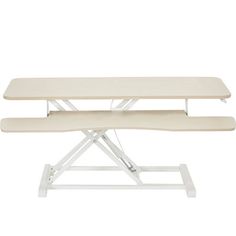 two white ironing boards sitting on top of each other