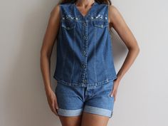 Blue Denim Top Sleeveless Jean Shirt Embroidered Denim Shirt Women's Denim Vest Loose Fit Model is 5.77 ft (176 cm) tall, she normally wears size S/M Measurements (lying flat): Pit to pit: 19''/ 48.5 cm Length: 20''/ 51 cm Shoulder: 15''/ 38.5 cm Please check measurements to insure a proper fit. Remember to allow yourself some extra room for movement. You can compare these with something from your closet that fits you well. Condition: Great Vintage Condition SHIPPING: * I ship worldwide via Priority mail (Latvijas Pasts) from Latvia (EU). * Items are shipped 1 - 5 business days after receiving the payment. * I ship from Europe, so please allow 2 to 4 weeks for the package to arrive if you live overseas. * Europe 5 - 10 business days. Embroidered Blue Denim Vest For Summer, Blue Embroidered Denim Vest For Summer, Summer Embroidered Blue Denim Vest, Casual Embroidered Denim Vest For Summer, Summer Embroidered Denim Vest, Embroidered Denim Blue Top For Summer, Summer Embroidered Denim Top, Blue Denim Top, Womens Denim Vest