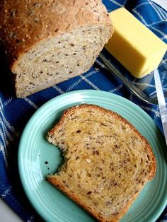 bread and butter are sitting on a blue plate