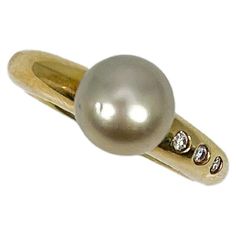 18k yellow gold Tahitian pearl and .06 CTW diamond ring. This ring has three round diamonds to the side of the pearl, the diameter of the pearl is 8 mm, the size of the ring is a 6 1/4, and it has a total weight of 6.65 grams. Luxury Yellow Gold Rings With Tahitian Pearl, Tahitian Pearls, The Pearl, Tahiti, Fashion Rings, Round Diamonds, Diamond Ring, Jewelry Rings, Yellow Gold