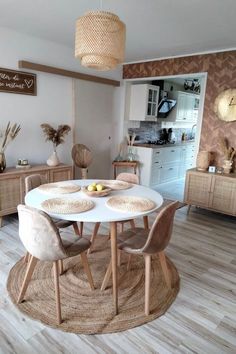 a white table and chairs in a room