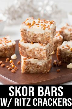 several pieces of cake sitting on top of a wooden cutting board with the words skor bars w / ritz crackers