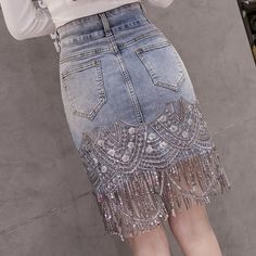 Make your friends admire you in this beautifully designed skirt. You will look gorgeous wearing our Women's Crystal Tassel Denim Skirt. There has never been such a nice outfit to feel unique for another day! Embroidery Silhouette, Empire Pattern, Light Blue Skirts, Tassel Skirt, Jean Mini Skirts, Denim Crafts, Denim And Lace, Refashion Clothes, Jeans Rock