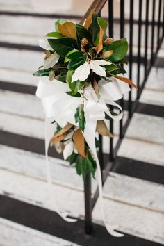 a bouquet of flowers sitting on top of a stair case