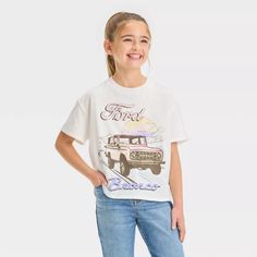 Girls' Ford Bronco Boxy Short Sleeve Cropped Graphic T-shirt - Ivory : Target Bronco Shirt, Ford Girl, Fits Clothes, Cropped T Shirt, Top Graphic Tees, Tshirt Outfits, Kids Outfits Girls, Ford Bronco, Pair Of Pants