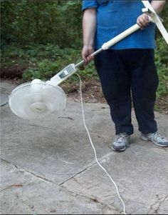 a person holding a brush and blower in their hand with the caption, aussie booan leaf blower seems legt