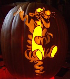 a carved pumpkin with a tiger on it