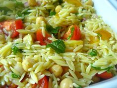 a white bowl filled with rice and vegetables