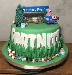 there is a green cake with the word fortine on it