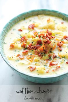 a bowl filled with soup and topped with bacon