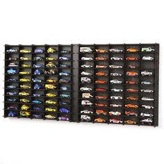 a wall mounted display case filled with toy cars on top of black shelving units