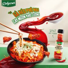 an advertisement for chili sauce and chicken wings with chopsticks sticking out of them