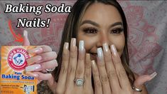 a woman is holding her hands up to her face with baking soda nails on it