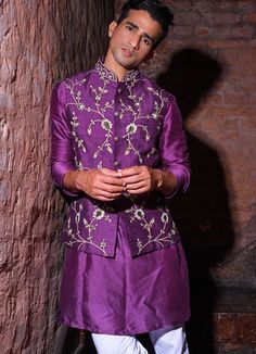 Features a purple silk bundi jacket embroidered with silver work teamed with a raw silk Kurta and white cotton chinos Buy the matching set for your partner here. Composition: Kurta and Bundi - Silk , Chinos - Cotton All products can be customised for sleeves, length of blouse and neck design Delivery : 4-6 weeks as the product is hand crafted. Check Size Guide or choose MySize for free customisation (All Sizes above XL can be made at 15% additional cost) For more information and sizes please contact fabiliciousfashion@gmail.com or visit our Copenhagen studio. Raw Silk Kurta, Silk Kurtas, Orange Mirror, Kurta Men, Purple Mirror, Purple And Silver, Gold Blouse, Silk Kurta, Sequence Work