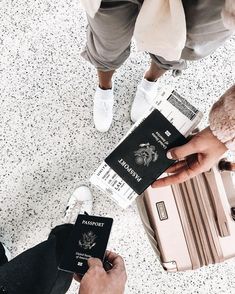 people standing around with their luggage and passport